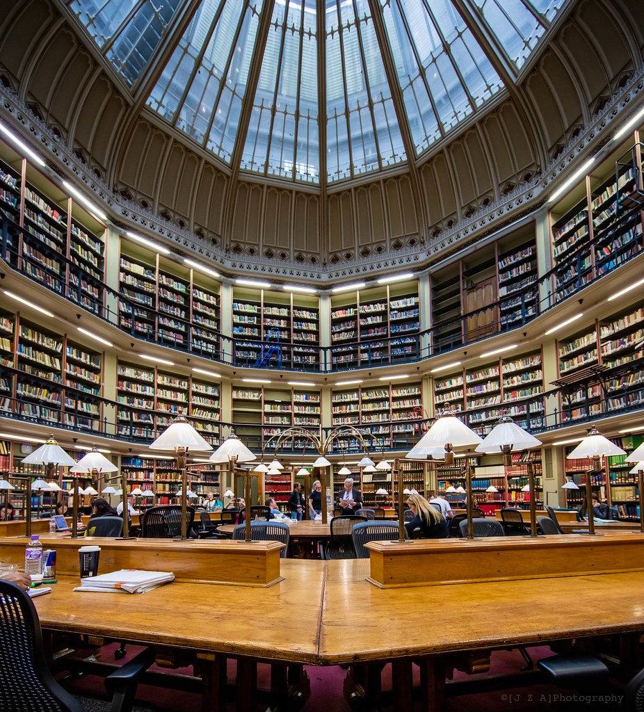 Students working in a large university library